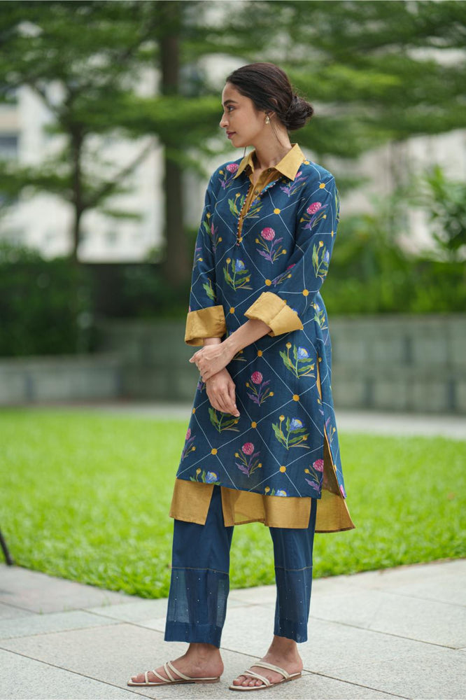 
                  
                    DAHLIA 2 LAYER KURTA blue geo mustard
                  
                